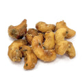 Cashew nuts with herbs on a white background